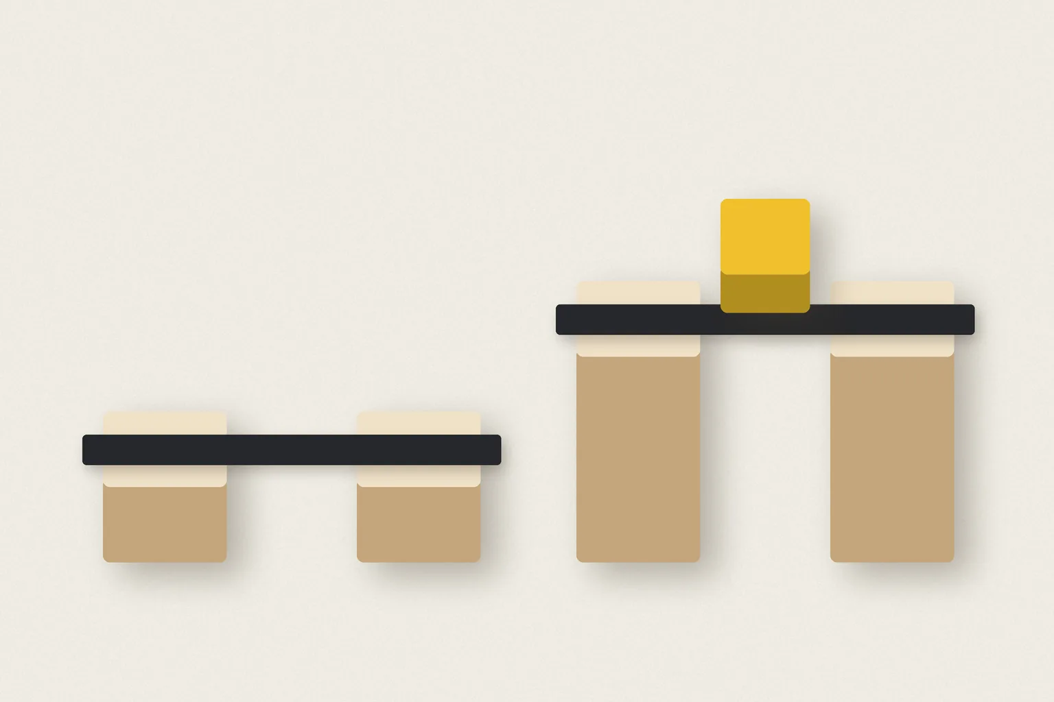 A black paper bar resting on cream wooden blocks, above a lower bar, with a yellow block on top.